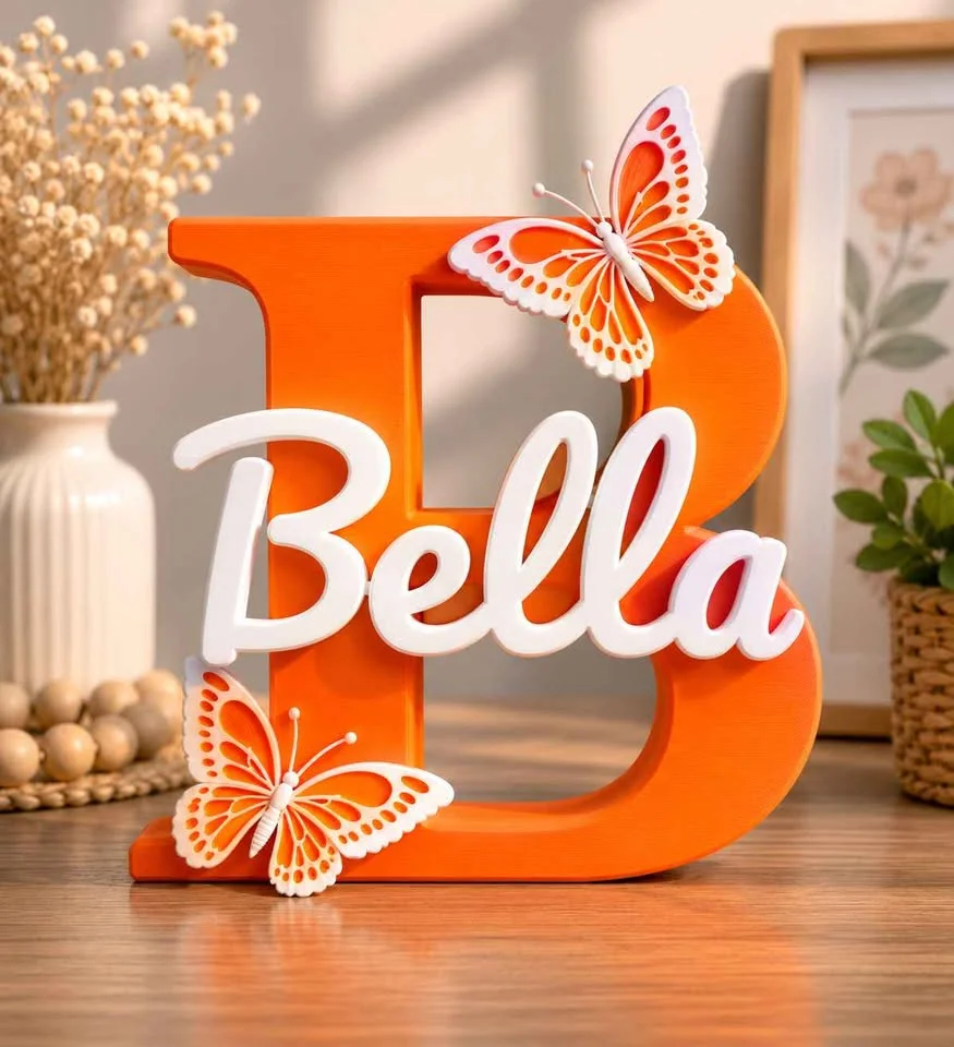 Illustration: orange letter B name sign with a white name and orange butterflies