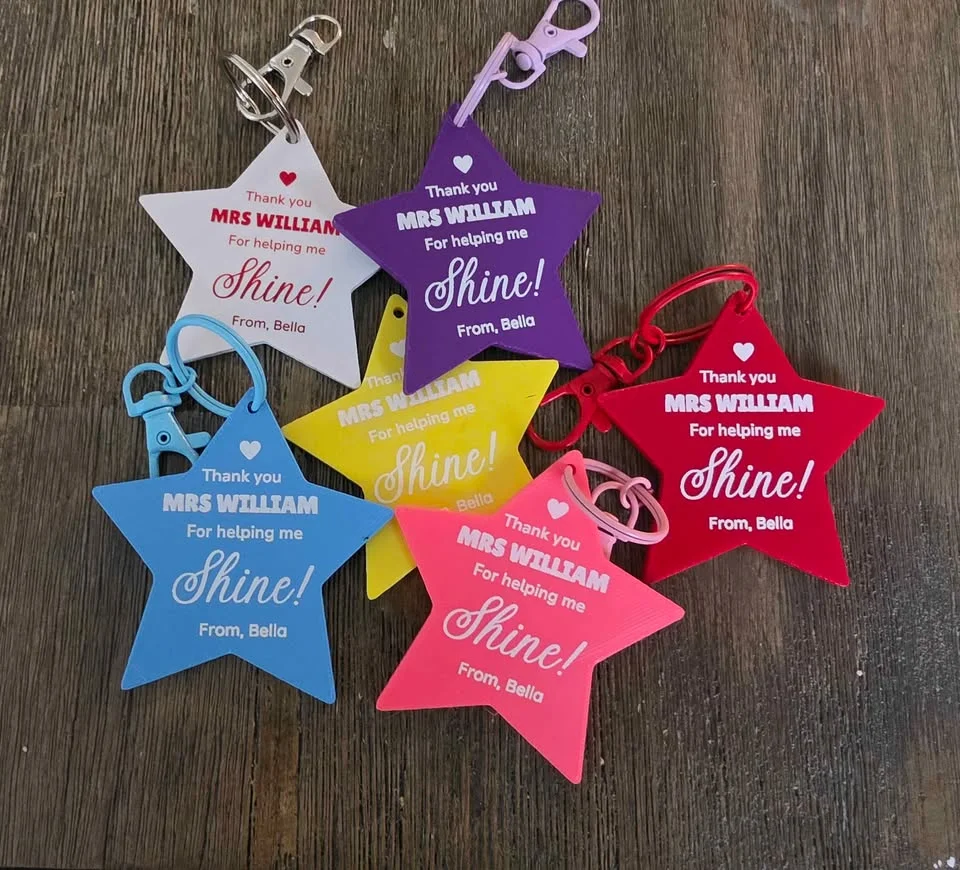 Star keychains in red, pink, purple, yellow, blue and white, each with a teacher thank-you message