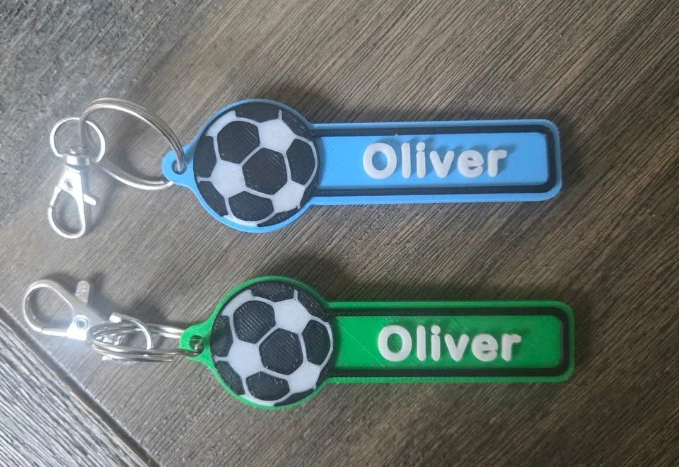 Two football design name bag tags in blue and green