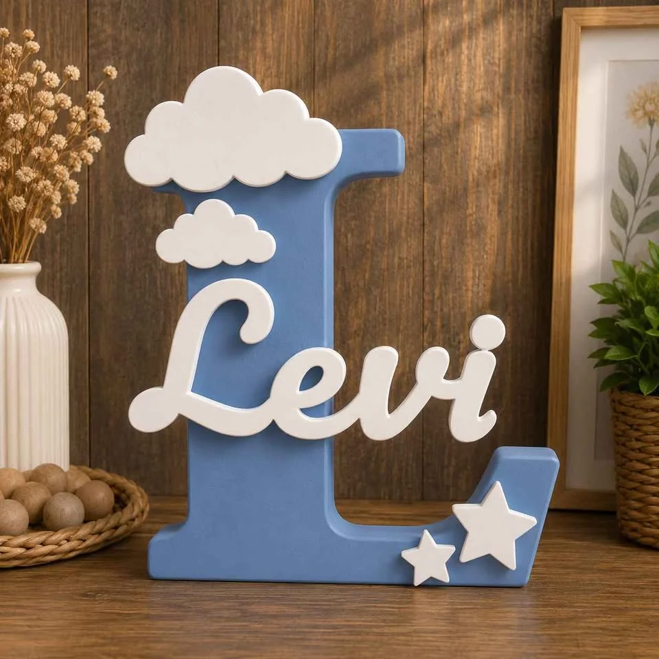 Illustration: blue letter L name sign with a white name, clouds and stars